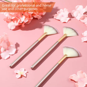 Maitys fan brushes in use applying powder makeup