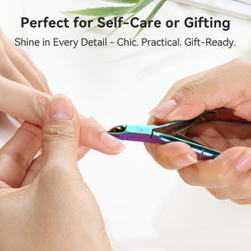Makartt cuticle nipper in use on a manicured hand