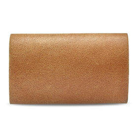 MAKYN Leather Cover lifestyle image with travel essentials