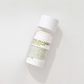 MALIN+GOETZ Bergamot Deodorant with citrus background