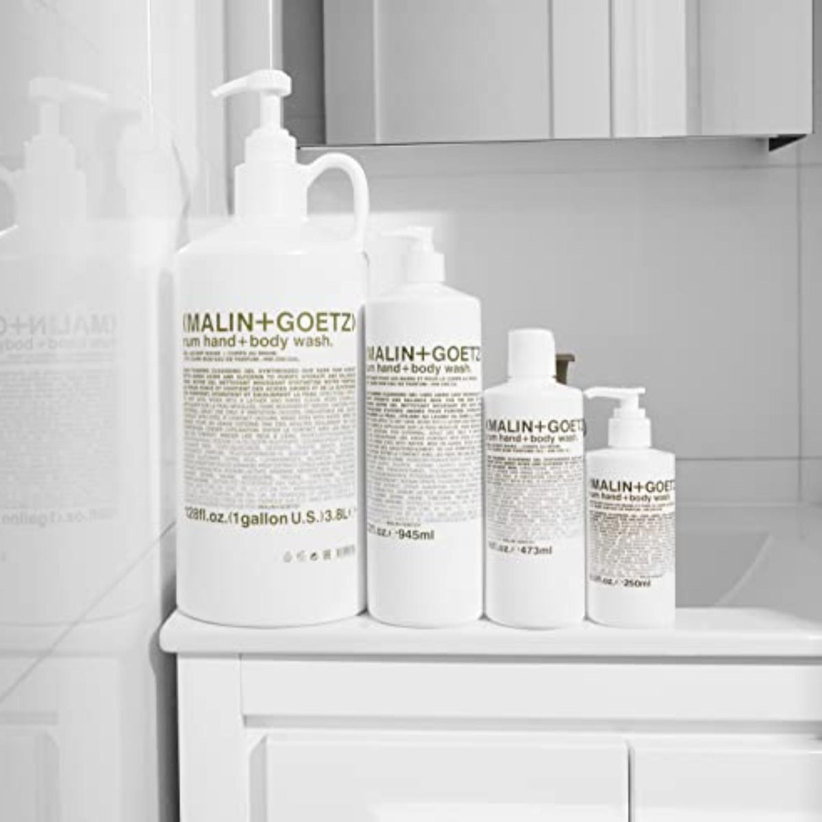 MALIN+GOETZ Rum Hand + Body Wash in a bathroom setting
