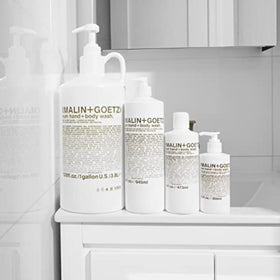 MALIN+GOETZ Rum Hand + Body Wash in a bathroom setting