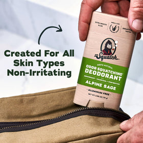 Man applying Dr. Squatch Natural Men’s Deodorant in bathroom mirror