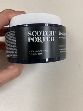 Man applying Scotch Porter Beard Oil to beard