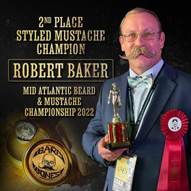 Man using THE VINTAGE GROOMING CO. Mustache Wax on his handlebar mustache