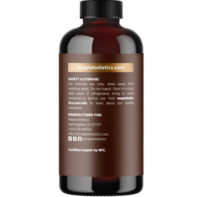 Maple Holistics Organic Castor Oil on a wooden surface