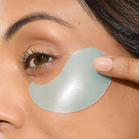 Mario Badescu Hydrogel Under Eye Patches displayed on a bathroom counter