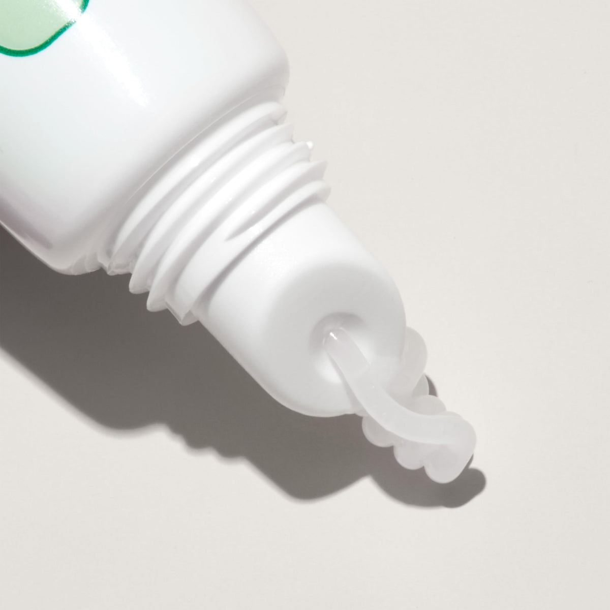 Mario Badescu Moisturizing Lip Balm on a wooden table