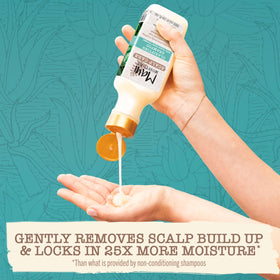 Maui Moisture Scalp Care Clarifying Shampoo in a bathroom setting