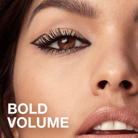 MAYBELLINE Volum' Express Colossal Mascara in use, showcasing bold lashes