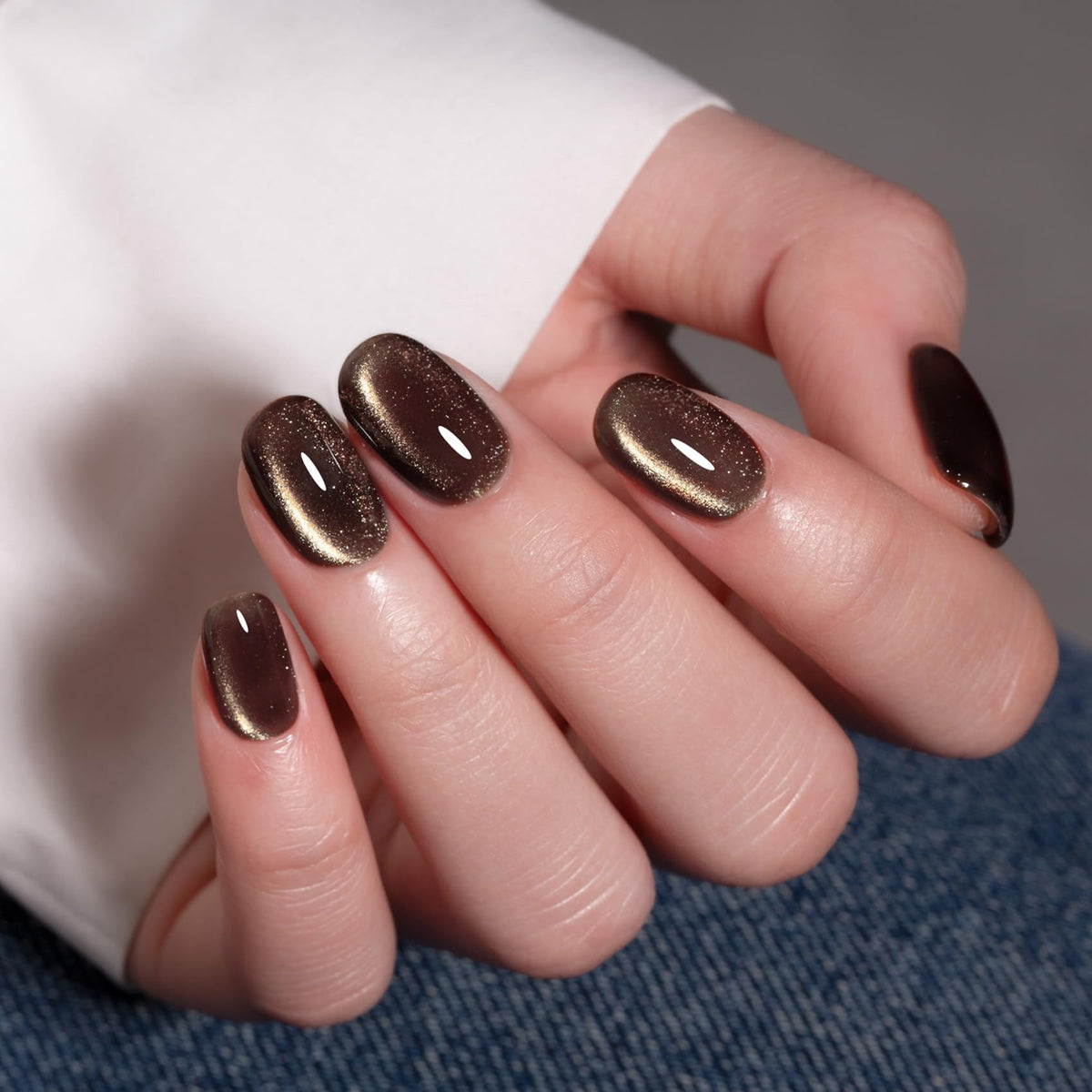 MAYCHAO Cat Eye Gel Nail Polish 15ML black polish on a nail art display