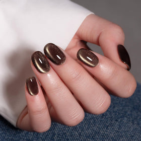 MAYCHAO Cat Eye Gel Nail Polish 15ML black polish on a nail art display
