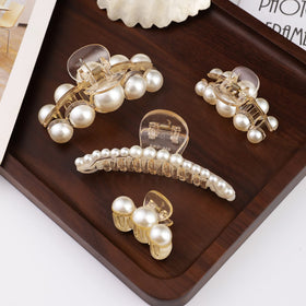 Mehayi Pearl Hair Claw Clips Set displayed on a table
