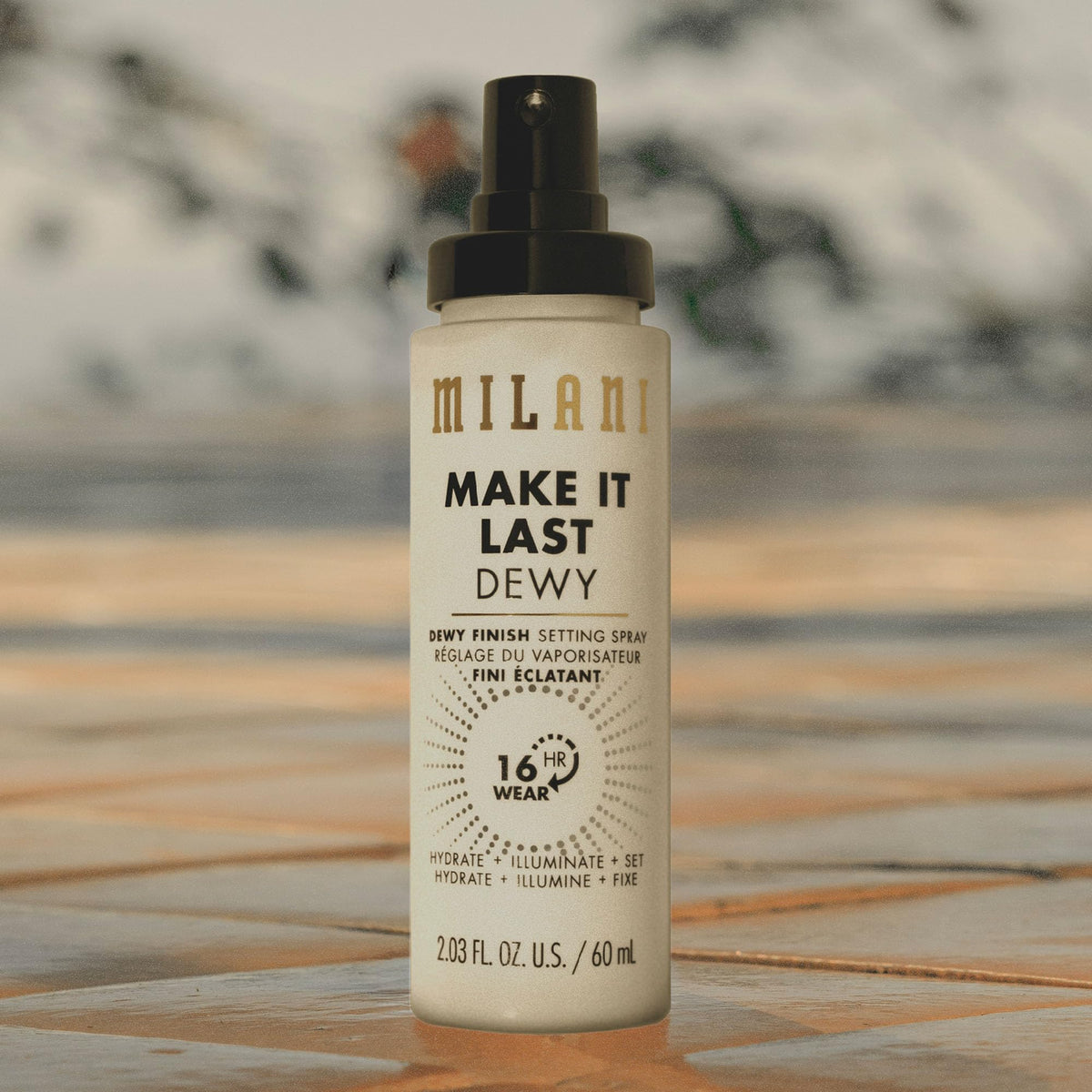 Milani Make It Last Dewy Setting Spray in a makeup bag