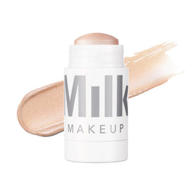 Milk Makeup Highlighter Stick in Turnt (Golden Peach) front view