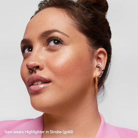 Milk Makeup Highlighter Stick on collarbones for a luminous look