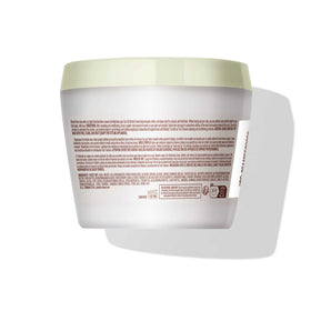 Mizani True Textures Coil Stretch Cream in use on coily hair