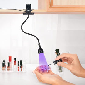 mlogiroa Clip-On UV Nail Light with securing clip attached to a laptop