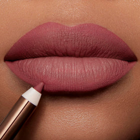 Model applying Charlotte Tilbury Lip Cheat Lip Liner