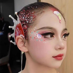 Model applying Go Ho Red and White Body Glitter on face