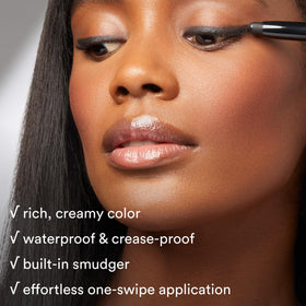 Model applying Julep Eyeshadow Stick Cocoa Shimmer