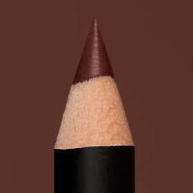 Model applying NYX Matte Suede Lip Liner in The OG Brew