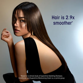 Model applying ORIBE Supershine Moisturizing Styling Cream