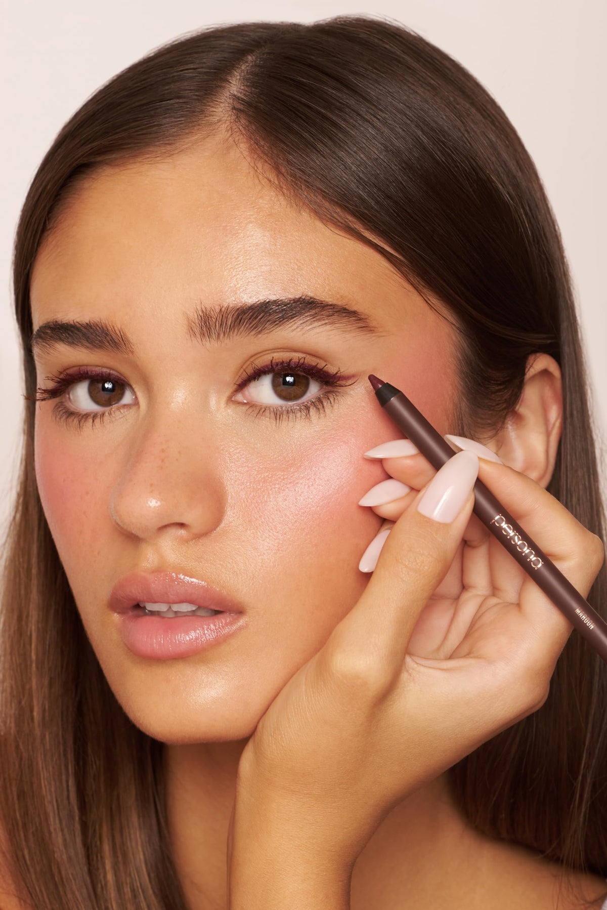 Model applying PERSONA Waterproof Eyeliner