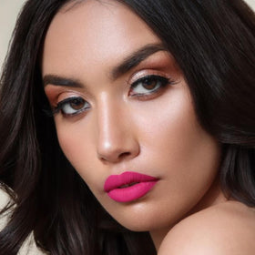 Model applying The Lip Bar Liquid Matte Lipstick