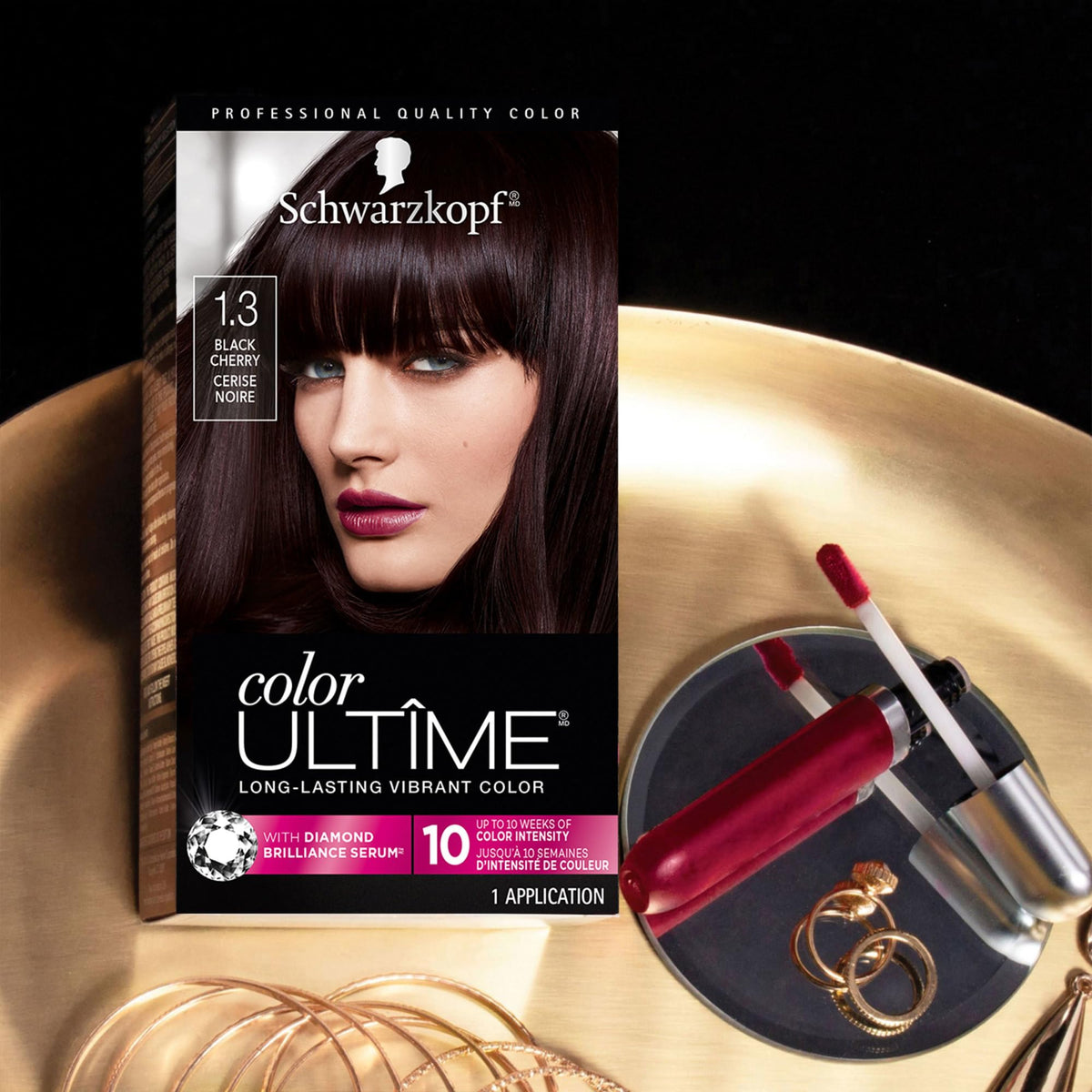 Model showcasing vibrant Black Cherry hair colour after dye application