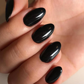 modelones Black Short Press on Nails Kit showing nail adhesive taps and glue