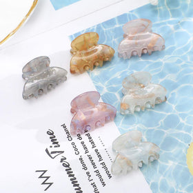 Molans Mini Hair Clips in a purse for easy access