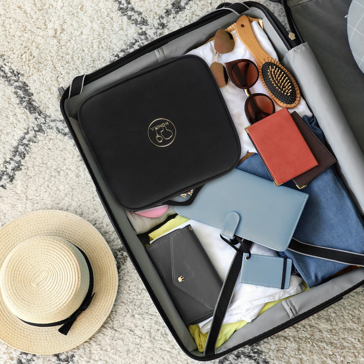 MOMIRA Travel Makeup Bag open showing interior compartments