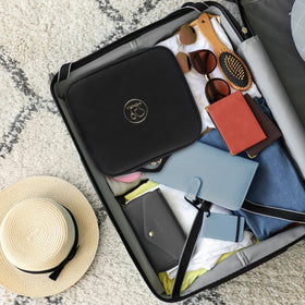 MOMIRA Travel Makeup Bag open showing interior compartments