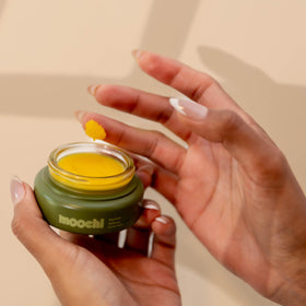 moochi Daytime Defense Barrier Balm on a vanity setup
