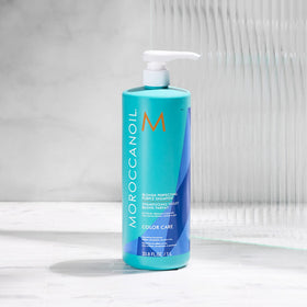 Moroccanoil Blonde Perfecting Purple Shampoo with argan oil background