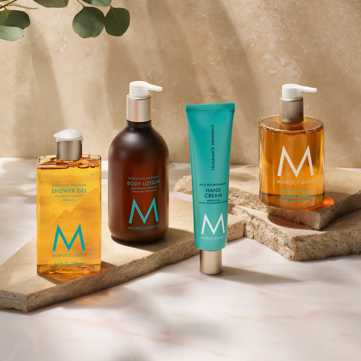 Moroccanoil Body Lotion Originale bottle with floral background