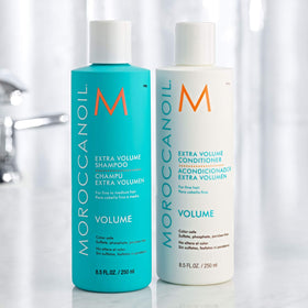 Moroccanoil Extra Volume Conditioner 8.5 Fl. Oz. on a bathroom shelf