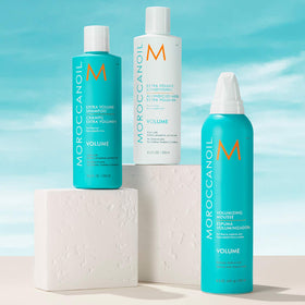 Moroccanoil Extra Volume Shampoo 16.9 Fl. Oz. on a bathroom shelf
