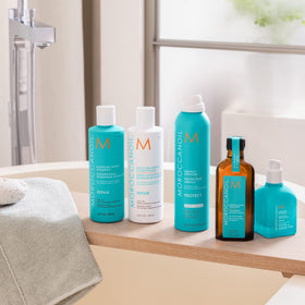 Moroccanoil Moisture Repair Conditioner 16.9 Fl. Oz. on a vanity