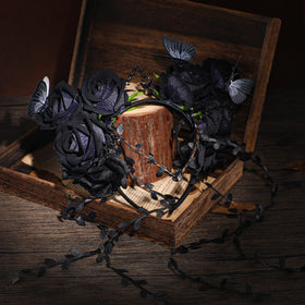 MOSTORY Black Flower Crown Headband with purple flowers close-up
