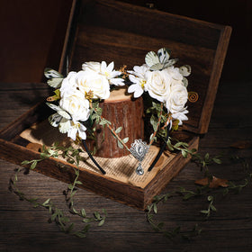 MOSTORY White Fairy Flower Crown displayed on a wooden surface