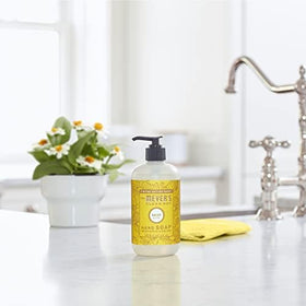 Mrs. MEYER'S Hand Soap Daisy Scent with floral background