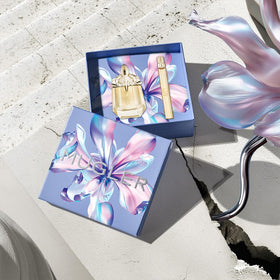 Mugler Alien Goddess Eau de Parfum bottle with floral background