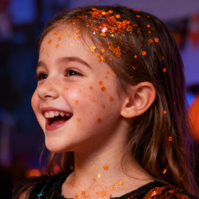 Mysense Orange Body Glitter Stick applied on skin for festival look