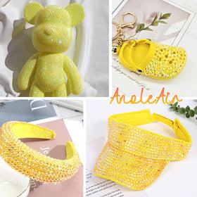 Nail art design featuring AnoleAir yellow rhinestones