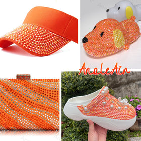 Nail art design featuring orange rhinestones