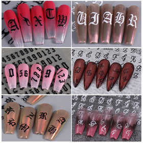 Nail art design featuring STZPRONAIL letter stickers
