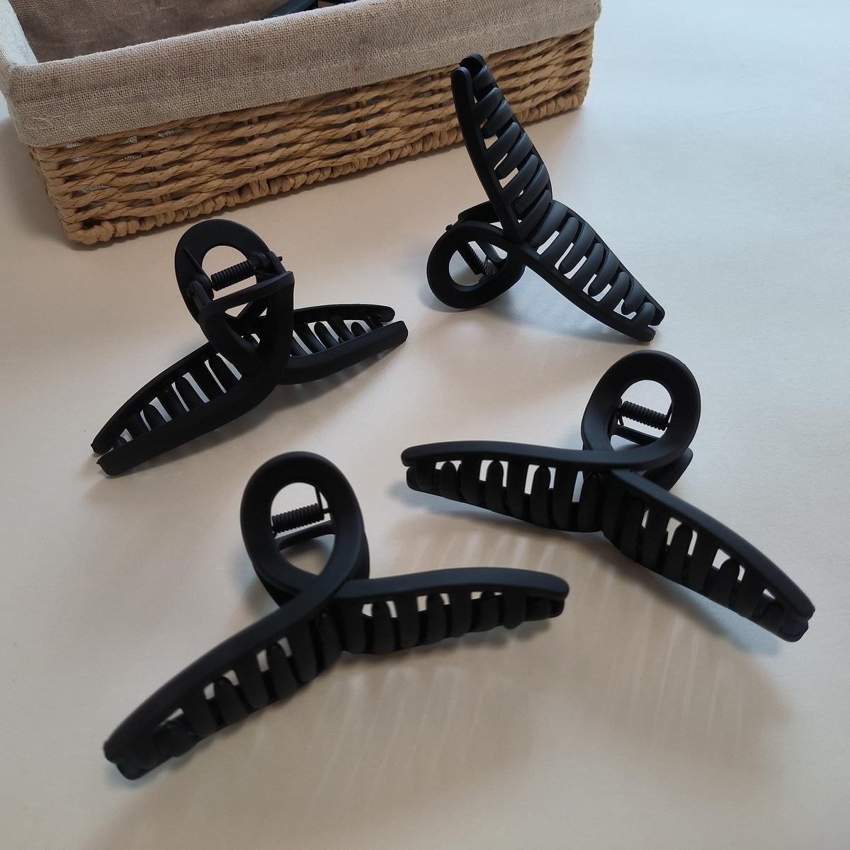 Nalodu hair claw clips displayed on a stylish background