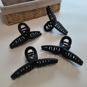 Nalodu hair claw clips displayed on a stylish background
